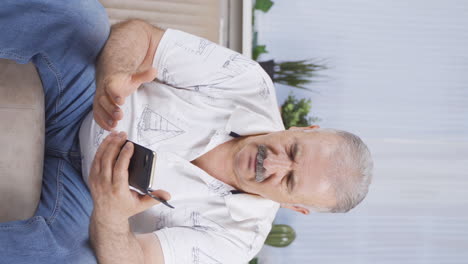 Vertical-video-of-Old-man-getting-breakup-texting-gets-upset.